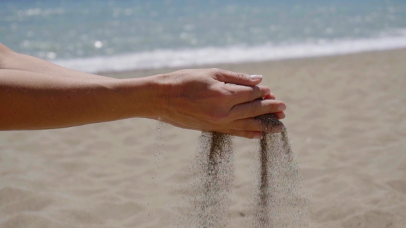 Stream Of Sand Pouring From Hands