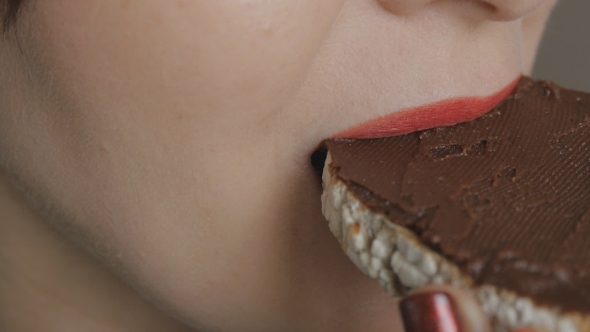 Girl With Red Lips And Nails Eats Toast With Homemade Chocolate Hazelnut Spread 