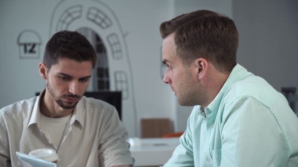 Young Man Candidate In Job Interview In Office.