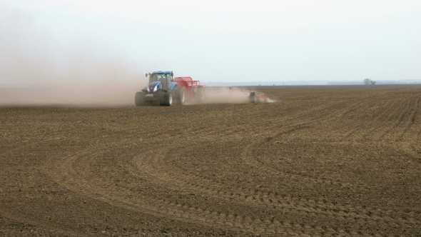 Tractor Ploughs Tills Plows And Seeds On The Field