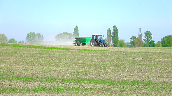 Tractor with Fertilizers in the Farm Field
