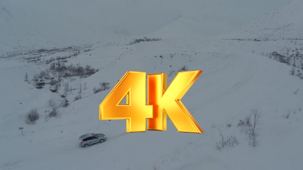 Car On Heavy Snowy Road In Mountains, Aerial View