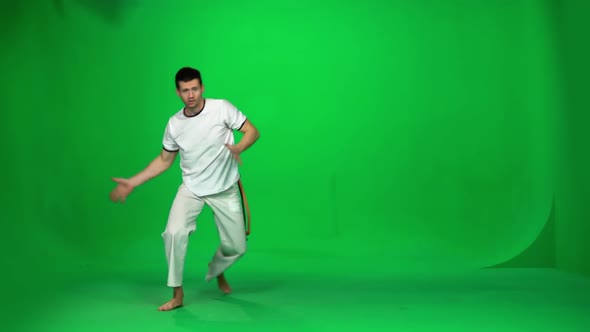 Man Practicing Capoeira on Chroma Key Studio. Slow Motion.