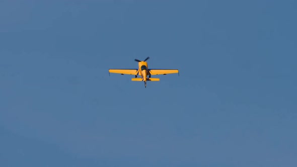 Yellow Plane in the Blue Sky