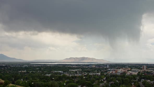 Overlooking Provo City as summer rainstorm moves through the sky