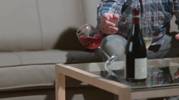 Man knocks over wine glass in slow motion; shot on Phantom Flex 4K at 1000 fps alt