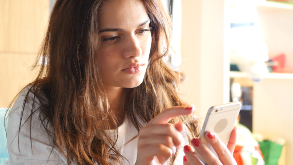 Girl Browsing, Surfing Online on Smartphone