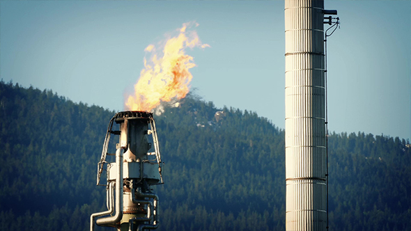 Gas Flames From Huge Refinery Pipe