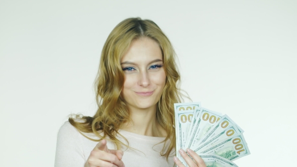 Attractive Woman Shows a Fan Of Money Concept