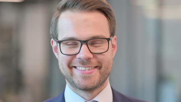 Face Close up of Businessman Smiling at Camera