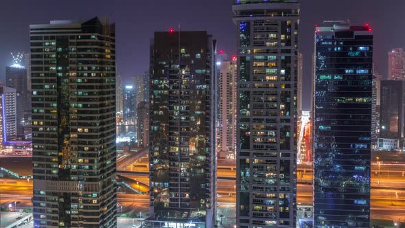 Residential and Office Buildings in Jumeirah Lake Towers District Night Timelapse in Dubai