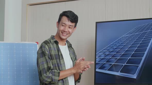 Asian Man Engineer Succeed Presenting About The Work Of Solar Cell Before Clapping Her Hands