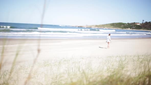 Woman walking on beach