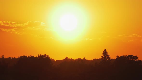 Golden Sunset Over Horizon Timelapse