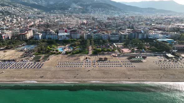 Empty sun loungers on the beach aerial view 4 K Turkey Alanya