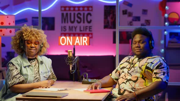 Portrait of Two African American Podcasters in Studio