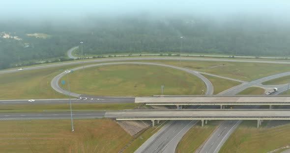 A Dense Fog in the Early Morning Around the Bridge Across US 65 Highway Near Satsuma Alabama in USA