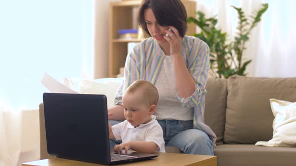 Working Mother with Baby Calling on Smartphone 