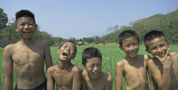 Happy Kids In Rice Field