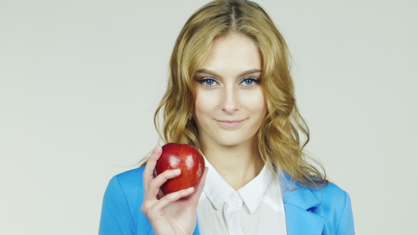 Attractive Woman With Red Apple