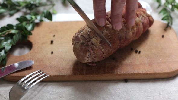 Man Is Cutting Slice Of Smoked Ham