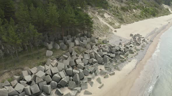 Concrete Tetrapods Laying On The Beach Front