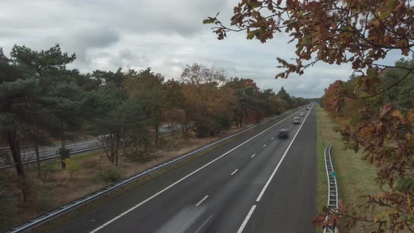 Motion Timelapse Of Vehicles Driving On The Highway During Autumn.