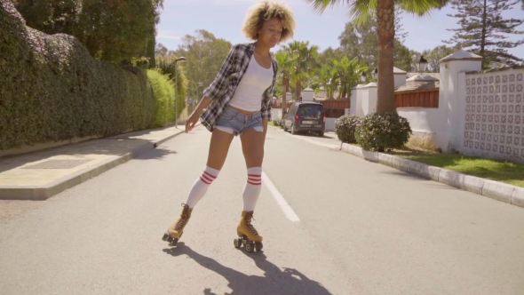 Woman Skating Down The Street