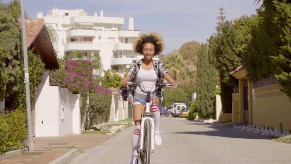 Young Woman Riding The Bicycle