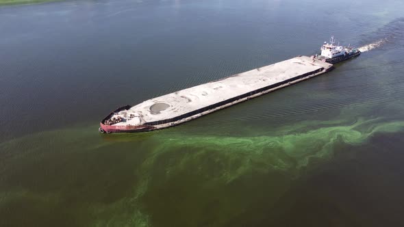 A Dry Cargo Ship Pushes an Empty Barge Down the Dnieper River