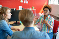 Unposed group of creative business people in an open concept office brainstorming. - PhotoDune Item for Sale