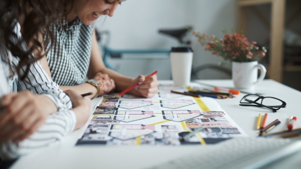 Two Women Working Together At An Architect Office