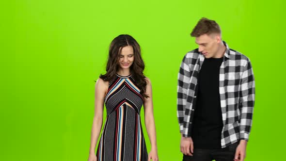 Couple in Love, They Laugh, Kiss and Have Fun. Green Screen