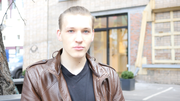 Young Man Looking in Camera