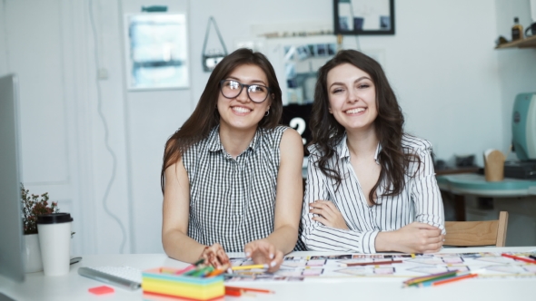 Two Women Working Together At An Architect Office