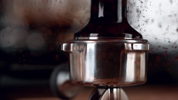 Super Slow Motion Shot of Tamping Fresh Ground Coffee at 1000Fps