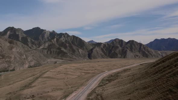 Chuya highway in mountains valley of Altai with traffic cars