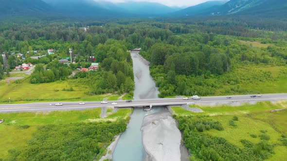 4K Cinematic Drone Video (truck right) of Seward Highway Alaska Route 1 over Glacier Creek with Gird