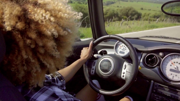 Young Woman Driving Her Cabriolet