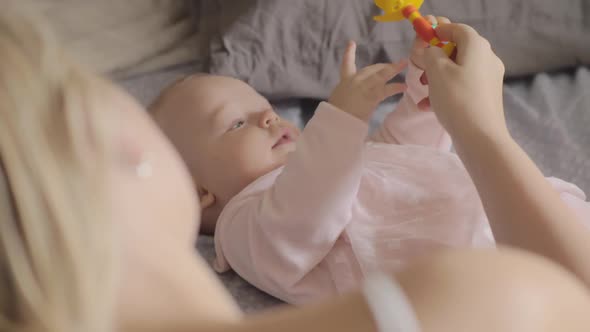  - Mother Playing with Her Newborn Daughter