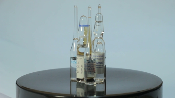 Ampoules Rotate On a White Background 2