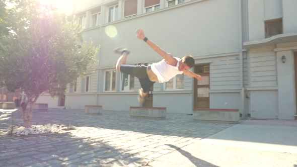 Guy Doing Acrobatic Tricks On The Street