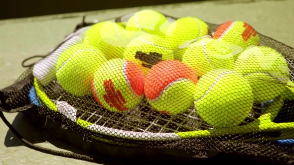 Net Bag Of Tennis Balls For Training On a Racket