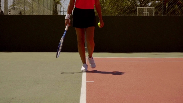 Young Woman Standing On The Baseline