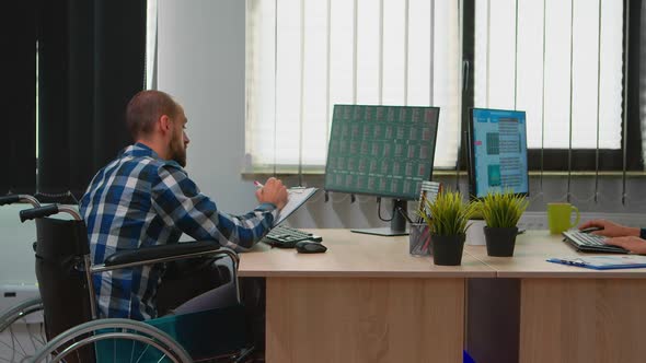 Paralysed Businessman Making Financial Expertise