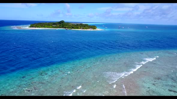 Aerial drone shot tourism of perfect resort beach adventure by blue green ocean and white sand backg