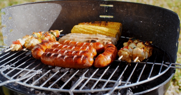 Sausages  Corncobs And Kebabs Grilling On a BBQ