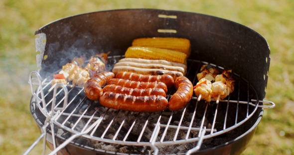 Sausages  Corncobs And Kebabs Grilling On a BBQ