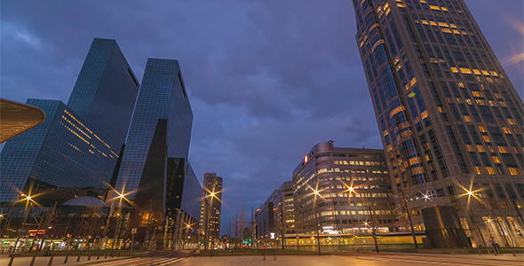 Downtown Traffic in modern City at Dusk alt