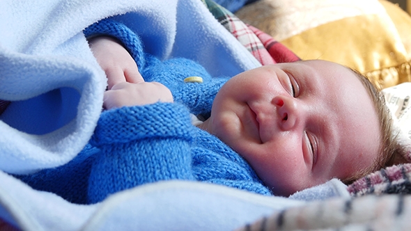 Newborn Baby Smiling In His Sleep